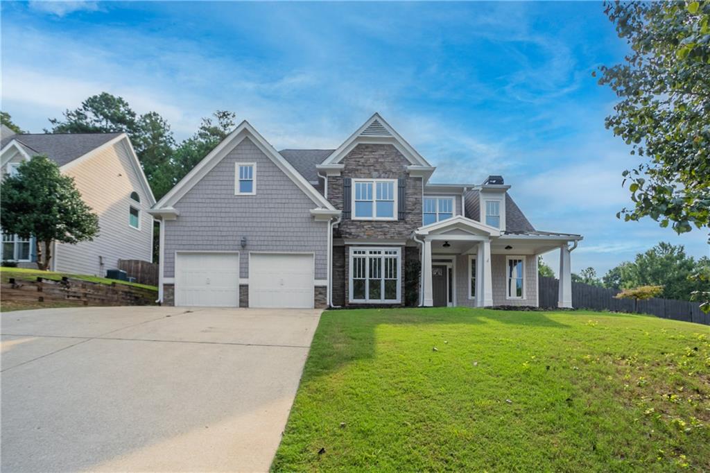 This beautifully updated home features fresh exterior and interior paint, new carpet, LVP flooring, and stylish light fixtures. The kitchen shines with painted cabinets, quartz counters, subway tile backsplash, new dishwasher and cooktop, plus a large island with vent hood. Enjoy soaring ceilings in the living room with a cozy fireplace and built-in shelving, perfect for both entertaining and everyday living.