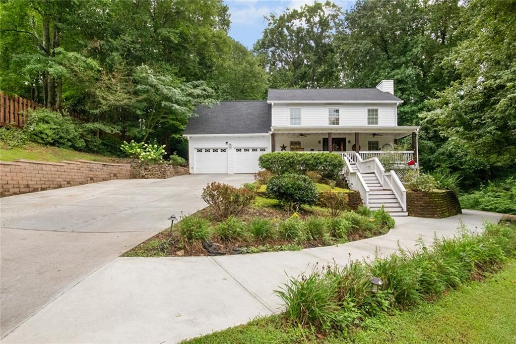 Rare Southern Charm in Woodstock – No HOA!
Welcome to a unique opportunity to own a beautifully updated home tucked away in a quiet subdivision — with no HOA restrictions. Surrounded by lush, mature landscaping, this charming property seamlessly blends timeless Southern character with thoughtful modern upgrades.
Step onto the inviting covered front porch and into a bright, open-concept living space, featuring an updated kitchen with ample storage and a convenient mudroom.
Enjoy the flexibility of two spacious master suites, including one on the main level with a private office or keeping room and a fully renovated ensuite bathroom — perfect for multi-generational living or hosting guests. The second master suite also offers an updated full bathroom and generous closet space.
Each secondary bedroom includes its own ensuite bathroom, ensuring comfort and privacy for every occupant. The finished basement provides an additional bedroom, plentiful storage, and flex space ideal for a home gym, media room, or office.
Step outside and experience your private backyard oasis: a resort-style pool with a waterfall feature, a barn, manicured gardens, and a fully fenced yard with a double-door black iron gate, offering added privacy and additional storage access.
Enjoy peace of mind with newer HVAC systems, a new water heater, new roof, and fresh paint inside and out.
Conveniently located just minutes from shopping, dining, major highways, and one exit from The Woodstock Outlet Shoppes.
This home offers the perfect combination of charm, convenience, and freedom.
This rare gem truly has it all — don’t miss your chance to make it yours.