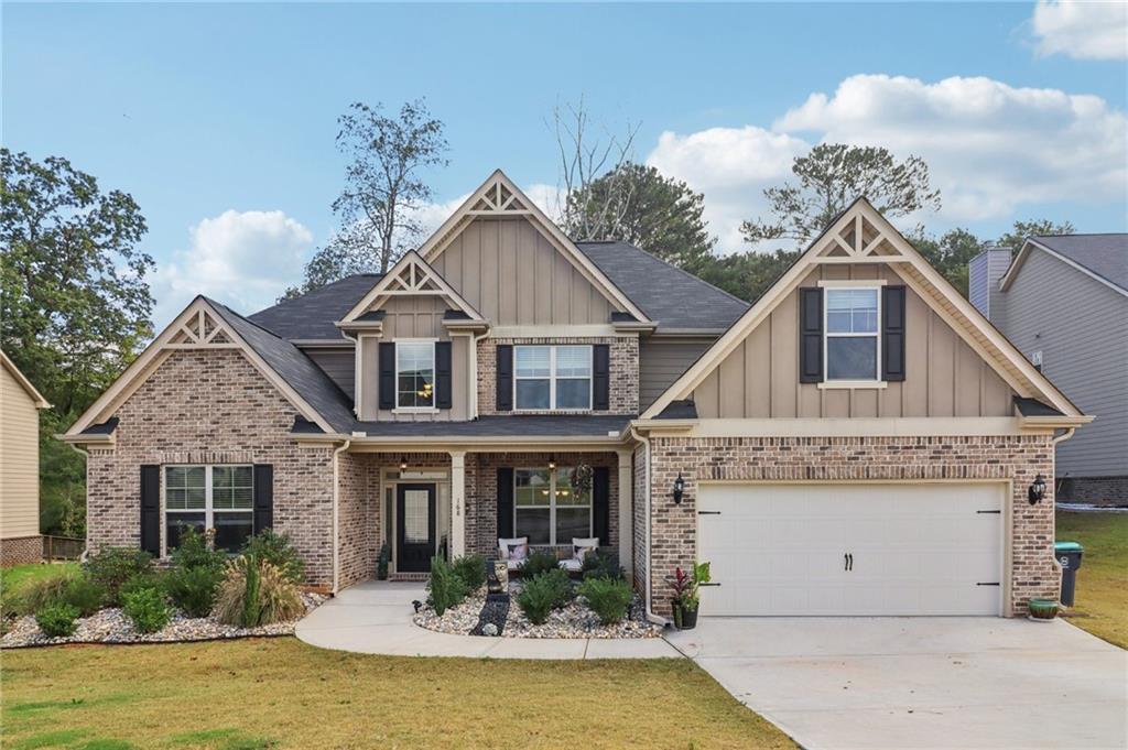 Welcome home to The Registry, one of McDonough’s most desirable neighborhoods within the sought-after Union Grove school district. Built in 2022, this five-bedroom, four-and-a-half-bath brick sided home offers thoughtful upgrades and an open layout ideal for entertaining or multi-generational living.
Step through a grand two-story foyer into elegant formal living and dining rooms with striking coffered & cathedral ceilings. The chef’s kitchen features stainless steel appliances, double ovens, gas cooktop, large island, and a custom pantry with wine rack and basket storage—all overlooking the vaulted family room with fireplace.
The main-level owner’s suite provides a serene retreat with tray ceilings, a sitting area, and a spa-inspired bath boasting dual vanities, a soaking tub, and a tiled shower. Upstairs, you’ll find four additional bedrooms and three full baths, with charming custom accents throughout.
Outside, enjoy a level backyard with an extended patio, and tasteful custom river rock landscaping in the front. A two-car garage provides ample space, and a painted backyard shed matching the home’s exterior may remain with an acceptable offer.
Just minutes from Kroger, Costco, and Sprouts, this home offers an exceptional balance of comfort, community, and convenience.