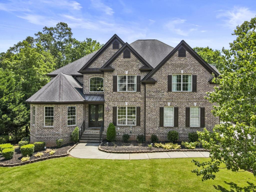 Welcome to Old Place at Crabapple!  This beautiful home is situated in the heart of Milton/Crabapple with all the community has to offer.  It is mere steps from the Milton library and The Crabapple Market, with great proximity to all three community schools. With easy access to Downtown Alpharetta, Avalon and GA-400, the location cannot be beaten!  The home sits on a quite street of secluded custom homes, offering sidewalks and a cul-de-sac. Inside there is space for everyone, from two large main level living areas, an upper-level loft and a finished terrace level. You enter a two-story foyer, flanked by a dedicated office, living area and dining room.  In the heart of the home, you will find a large kitchen overlooking a generous family room and access to a rear deck. There is one main level bedroom suite and a dedicated drop zone area off the garage.  Upstairs is an oversized primary suite and bathroom overlooking a beautifully landscaped yard.  There are three secondary bedrooms and two additional baths, in addition to the large loft and additional flex space.  The terrace level is the perfect gathering spot for entertaining or even a dedicated in-law suite.  Here you will find a kitchenette, recreational space, home theater, full bathroom and two additional areas for a gym or slumber. Off this level is a covered patio and a professionally landscaped yard, that offers privacy, serenity, and a perfect place to add a pool!  The HOA covers landscaping, weed control and trash pickup.  This gives you more time to head up to "the green" for one of their summer concerts, visit the Saturday farmer's market, have dinner at the new steakhouse or maybe just grab a book from the library and head to one of the local coffee shops.  The trio of schools are top notch, beginning with Crabapple Crossing Elementary School, then Northwestern Middle School and finally, Milton High School.  Make 985 Old Place Drive yours! Square footage: main level, 5424 plus additional 2186 in terrace level