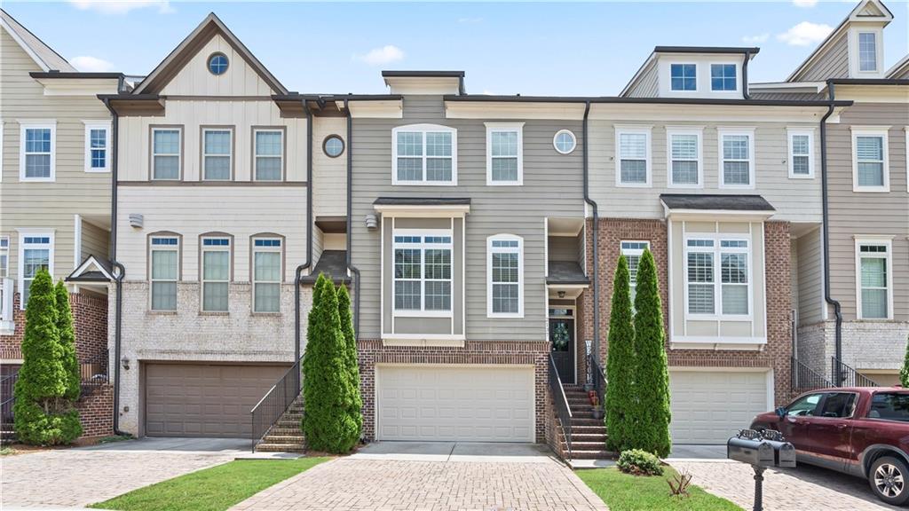 OCCUPIED TILL 8/31/2025. SHOWING BY APPOINTMENT ONLY, Do Not Disturb. Minimum requirement: 680+ credit score, $9000+ combined monthly income, employment verification, background check, $7000+ in bank reserves, good references...etc. Welcome to this beautifully designed townhome in Atlanta’s Upper Westside – Vinings on the Chattahoochee! This elegant and functional 3 level townhome offers an expansive, Open floor plan with 10’ ceiling on main, beautiful Crown molding, wood and laminate flooring. Open concept Kitchen with island, walk in pantry, SS appliances (gas range), granite countertop, tiled backsplash with modern espresso cabinets and large rear balcony deck. Top level: Master suite with tray ceiling, walk-in closet, double vanity and large tiled shower. 2 secondary bedrooms, hallway access full bath and laundry closet. Terrace Level: large bonus/flex space great for multiple usage and a full bath. Fenced in level backyard. Resort style community amenities: in-ground pool, 2 tennis courts, and a playground, Dog park, Clubhouse and Fitness center. Nestled Inside the Perimeter, a prime location near Buckhead, Midtown, Downtown, and The Battery in Smyrna. This townhome offers unparalleled convenience with easy access to shopping, dining, entertainment, and Hartsfield-Jackson Airport. This is luxury townhome living at its finest!