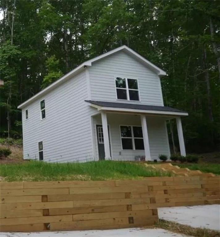 Like new! Spacious 2 bedroom/2-bathroom home in sought after Forsyth County. Main level features half bath, laundry, open kithcen with beautiful white cabinets, granite countertops, island, and cozy fireplace in living room. Both Bedrooms and full bathrooms are on the second level. Covered front porch. Professionally managed.