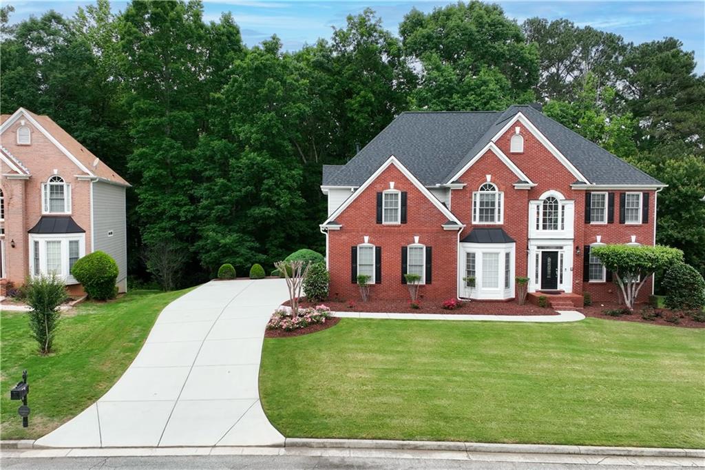 REVISION –The CORRECT square footage is 5,367 square feet confirmed by Appraisal Reports. This square footage includes a FINISHED BASEMENT.
Welcome to this beautiful home where every day feels like a dream. This spectacular and meticulously maintained home within a lake community is in the backdrop of Stone Mountain Park. The first thing you will notice upon entering the home is the quality, attention to detail, and meticulous maintenance. The Main level boasts an open-concept floor plan, allowing for a seamless flow between the living spaces. The beautifully designed Kitchen features a gas stove top, high-end custom granite countertops, a new dishwasher, ample storage, and a center island, making it a dream for cooking and entertaining with family and friends. The two-story Family Room is enriched with a cozy marble front fireplace and custom built-in bookcases, and complemented with large picturesque windows showcasing the beauty and quietness of the naturally wooded setting in the backyardathereby creating a beautiful and inviting experience for privacy, relaxation, and entertainment. A versatile study/ bedroom/home office space with a full bathroom completes the main level. Dual stairs with easy access from the Foyer or Kitchen to the Top level of the house. Step out from the Kitchen onto an extravagant Trex deck that features railing posts that have Solar-lighted caps making for a stunning nightly view. The luxurious Owneras Suite is a true sanctuary featuring a sitting room and spa-like bathroom, complete with his/her closets, jetted tub, separate shower with bench, and dual vanities. The Lower Level embodies a finished basement just right for an in-law suite encompassing a full bathroom, full Kitchen, Entertainment Area with stove and refrigerator, and large Family Room with vaulted ceiling and fan. The flooring is LVP in all areas and beautiful porcelain tile in Kitchen/Entertainment Area. From the Basement, step outside into your own private oasis-like backyard and embrace the beauty and privacy of the property. There are no homes in full view from the backyard. In addition to the lake, the community has a clubhouse, tennis courts, outside exercise, walking trails minutes from Stone Mountain Park, shopping, restaurants, and medical services. This home's appealing design, high-quality finishes, and commendable maintenance make it a compelling opportunity for those seeking a blend of comfort, luxury, value, and convenience. It stands ready to provide a lifetime of memories for one fortunate family. With its unbeatable location, captivating charm, and modern amenities, this home is not merely a place to live, itas a place to love. Don't miss your chance to own this gem and make this stunning home your next home!
