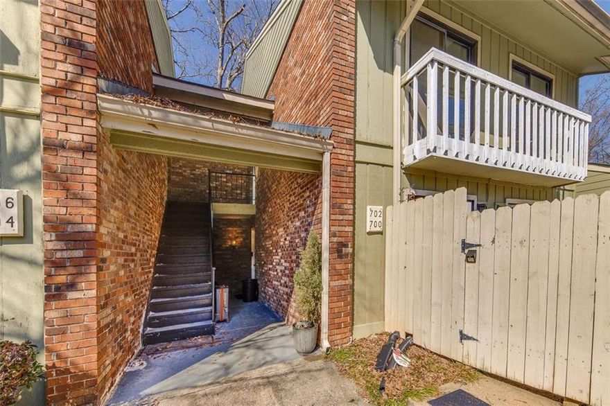 Welcome home to 702 Hanover Lane!  This move-in ready 2 bedroom, 2 full bathroom condo has been well maintained & tastefully updated with new luxury vinyl flooring, LED lighting, light & plumbing fixtures & new interior paint.  With every room having direct access to a covered patio you can find your favorite place to relax & unwind. This second-story unit has no one above it & comes with access to the attic for additional storage.   Located inside of the sought-after Covered Bridge community, you will have access to the community pool, tennis courts & clubhouse.  You will also be conveniently located close to shopping, restaurants & Marietta City Schools! **The unit is scheduled to receive a new roof with the special assessment being paid by the seller at closing.**