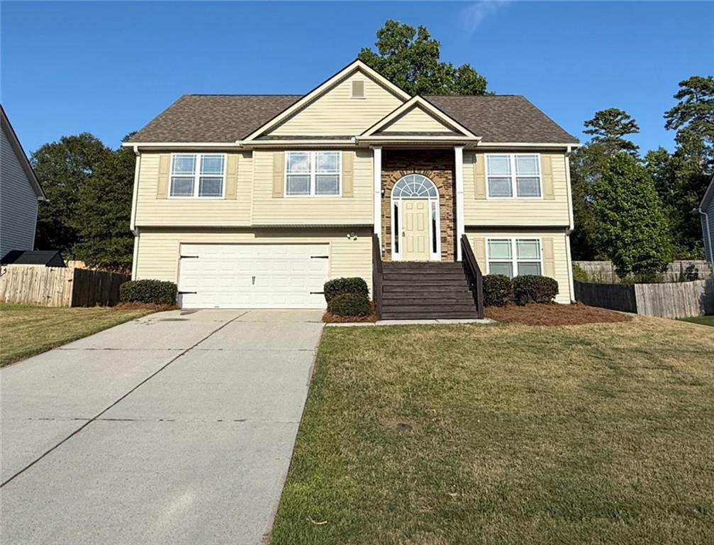 This move-in-ready 5-bedroom, 3-bathroom home features a bright and open floor plan. Best of all, it has BRAND NEW CARPET, NEW PAINT THROUGHOUT, AND NEW PAINT BOTH FRONT AND BACK DECKS, completed September 2025! The kitchen features stainless steel appliances and a breakfast area ideal for casual family meals. A separate, elegant dining room offers the perfect space for more formal gatherings. The large primary suite offers a private en-suite bath with a soaking tub and separate shower. The 4 additional bedrooms are spacious with nice closets. The 2 bedrooms on the main floor that can easily function as a guest suite, home office, or playroom, with additional full jack and Jill bath. The additional large living area on the main floor would prove to be perfect for a roommate or in-law set-up, providing privacy and comfort for everyone. Enjoy outdoor living on the covered patio overlooking a private backyard. Located in a friendly neighborhood minutes from Hwy 316, dining, shopping, and parks.