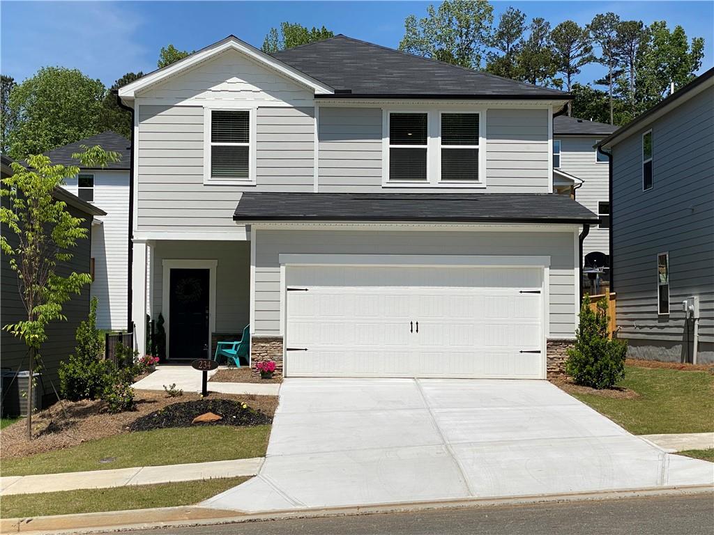 LIKE NEW in prime Holly Springs location! Sought after floorplan is light & bright, modern, open concept SmartHome with all you've come to expect: high ceilings, recessed lighting, stainless appliances, granite countertops, luxury vinyl plank flooring, tankless water heater, remote climate control, and keyless entry. Full main level suite PLUS primary suite and big loft space upstairs suitable for office/play/secondary entertainment center. Plenty of room for the whole family! And when you need to unwind, retreat to the covered back patio, or walk the quiet community neighborhood. Just off 575 and Sixes Road, Parc Terrace subdivision is near Cherokee Aquatic Center, One Life Fitness, Alpine Bakery, Publix, the outlet malls and downtown Woodstock!