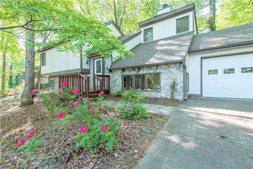 Great location, Best schools in East Cobb!! Close to shops, restaurants, medical centers. This lovely wooded retreat features new flooring, new paint, new window shades, granite counter-tops, stainless steel appliances, new fixtures, vaulted ceilings, spacious master, stone fireplace stretches to ceiling. Huge private deck with nice view of nature, perfect for entertainment and relaxation. Non-smoking home. Minimum 2 year lease. Security deposit is one month rent. First and last month rents plus security deposit are required to be paid at move in.