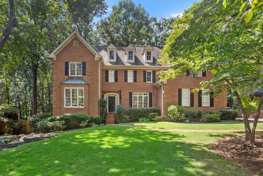 Great family home with good combination of formal and informal space allowing for multiple activities to take place at the same time. First floor is open and bright with large rooms and high ceilings. The large family room on the back of the home has a fireplace and a vaulted ceiling. The kitchen is large and opens up to the family room with a nice sized island and a breakfast area. The dining room is on the left side of the house and is large and bright. Also on the first floor is a library/office with ceiling height bookcases. The two car side entry garage has great storage, and a nice work room off of it. The master bedroom is on the second floor and has his and her closets. Three secondary bedrooms share two baths. The lower level is well finished off, and could be an in-law suite with a bedroom, full bath, a rec room, and a kitchen, and unfinished space which could be used for storage. The lot is the highest point of the subdivision, and captures a nice breeze most of the day. The front yard is relatively flat as is the backyard. A large multi level deck sits in the back with a nice grilling area. Attached to the back of the house is a room with a screened porch. This is a very special house in one of East Cobb's best  School Districts--Sope Creek.