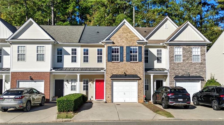 Perfectly positioned near Halcyon, The Collection at Forsyth, The Greenway, Fowler Park, golf courses, and quick access to top-rated schools, healthcare, grocery stores, shopping, dining, and year-round entertainment. All just minutes away! This cozy townhome offers convenience and low-maintenance living. A covered front porch and brick accent peak, complemented by a one-car garage and attached driveway for easy parking. Inside, the family room features a classic fireplace and mantel. Decorative column detailing leads into the eat-in kitchen with a pantry and open view to the family room, creating a comfortable, connected layout. Upstairs, you’ll find two spacious vaulted primary suites, each with French doors leading to private en suite bathrooms perfect for roommates, guests, or a dual-owner setup. The laundry room is conveniently located upstairs near the bedrooms for everyday ease. Step outside to a private patio with a wooded backdrop and a wood fence partition offering extra privacy. Yard maintenance and trash service are included, giving you a truly low-maintenance lifestyle. Residents also enjoy a community walking trail that winds around a peaceful pond with a water feature and pergola seating area. The perfect spot to relax or take an evening stroll. Experience the ideal combination of comfort, convenience, and community in this thoughtfully designed Forsyth townhome!