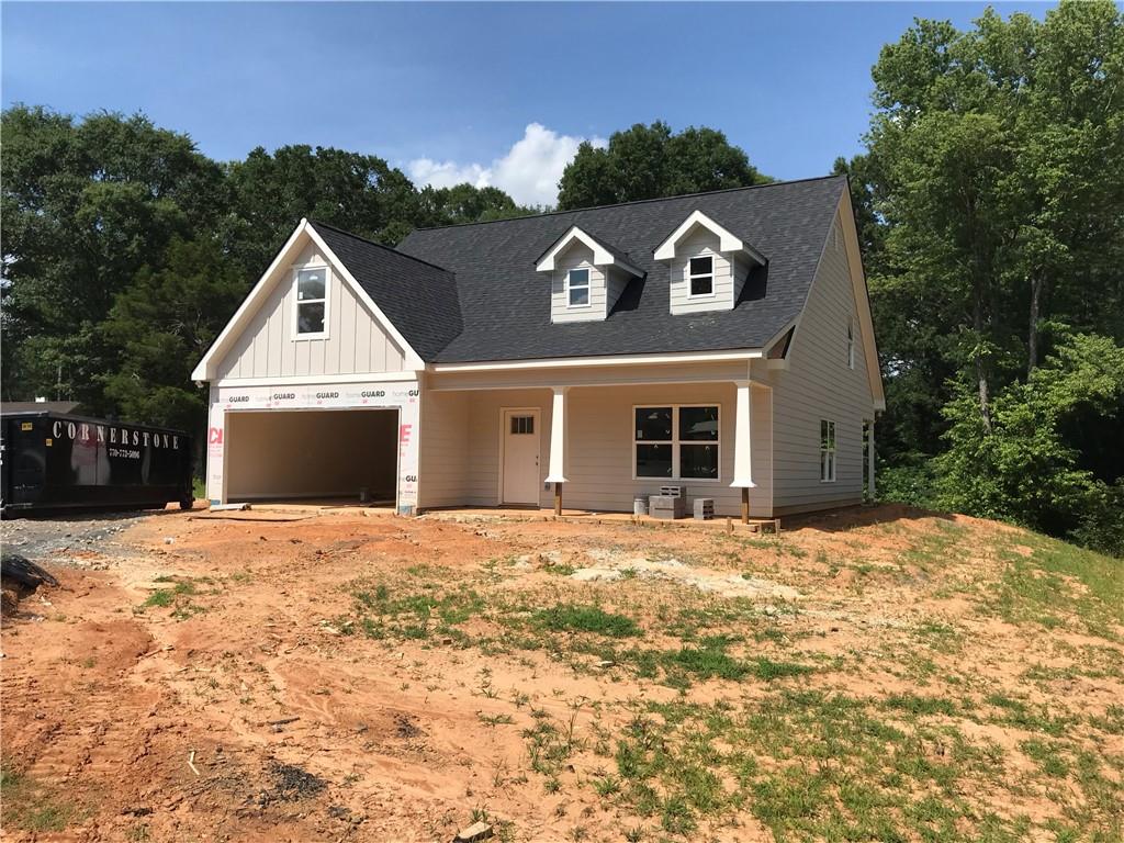 NEW CONSTRUCTION | 1.97 ACRES | MODERN CRAFTSMAN CHARM
A modern craftsman home is perched on a 1.97-acre property in Charleston Place II, which offers a sense of privacy, less than 5 miles to Interstate 75 and AdventHealth Gordon. This quality built open concept offers 4-bedrooms, 2.5-bathrooms and a bonus room. The exterior is complete with durable cement siding accented by stone details and a fresh, neutral color palette. A striking family room features a soaring ceiling and a stone surround electric fireplace. The open-concept layout flows in the dining area and kitchen seamlessly. A 6’ center island, ample cabinets and a separate pantry complete the kitchen. The primary suite, located on the main level, features a 5' tile shower, double vanity and a walk-in closet. Upstairs, two generously sized bedrooms share the spotlight with a flexible home office or optional 4th bedroom and a bonus room ready to become a playroom, media space, or quiet escape — the possibilities are endless. The rear covered porch overlooks a peaceful, wooded backyard, providing the perfect backdrop for morning coffee or evening gatherings. Located in an established community with desirable amenities, Charleston Place II offers a clubhouse, pool and playground—all ready for immediate use. This home offers nearly 2 acres of space and no compromise on design or build quality. Call today for details. Anticipated Completion August 2025. For a limited time, builder is offering a $5,000 concession toward closing costs or a rate buy-down with the preferred lender.