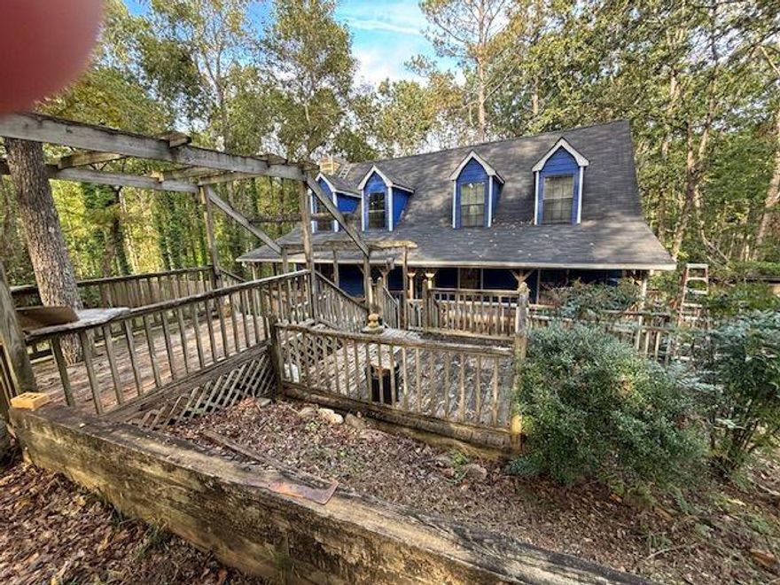 Investor Special with Tons of Potential in Ball Ground, GA!  Located in the peaceful Eagles Nest Ridge community, this 3-bedroom, 2-bathroom home sits on just over 2 acres—offering endless possibilities for renovation and value-add improvements.  Within the last six months, the owner has completed several updates including repairs to the downstairs bathroom, clean-up of the front deck, improvements to kitchen appliances, and front lot landscaping. While additional upgrades remain, this is a fantastic opportunity for an investor to finish the work or for a new homeowner to complete the vision and transform this property into a truly marvelous home.  Nearby comps show a strong market range, providing an excellent opportunity to net a solid return on your investment. Plus, the seller will include a brand-new HVAC system with professional installation with a full-price offer!  With multiple storage buildings and workshops already on site, there’s even more potential for customization or expansion. Enjoy the quiet, rural charm of Ball Ground while maximizing your investment. Being sold as-is with no warranty, this vacant property is ready for your ideas and improvements. Don’t miss this prime opportunity in North Georgia!