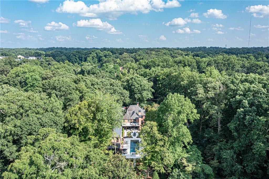808 Lullwater Road was impeccably and comprehensively renovated in 2020 reviving a 1923 Lewis and Crook classic Druid Hills home. Nothing was overlooked in this 7700 square foot home with 6 bedrooms, 6 baths and 2 half baths. The property includes 1-acre of meticulously manicured grounds, creating spectacular street presence, entertaining rooms, 50 foot pebble tech pool with spa, and a huge private back yard. 9 fireplaces, state of the art smart home system, whole house generator, all new HVAC, electrical, plumbing, and irrigation systems, all new windows and doors, 9.5 foot ceilings throughout and a slate roof are just a few of the many upgrades included. See Virtual Tour attached. Please note that 1 of the bedrooms, 1 bath and 1 half bath are in the carriage house and reflected in the Lower Level of Bedroom/Bath count.