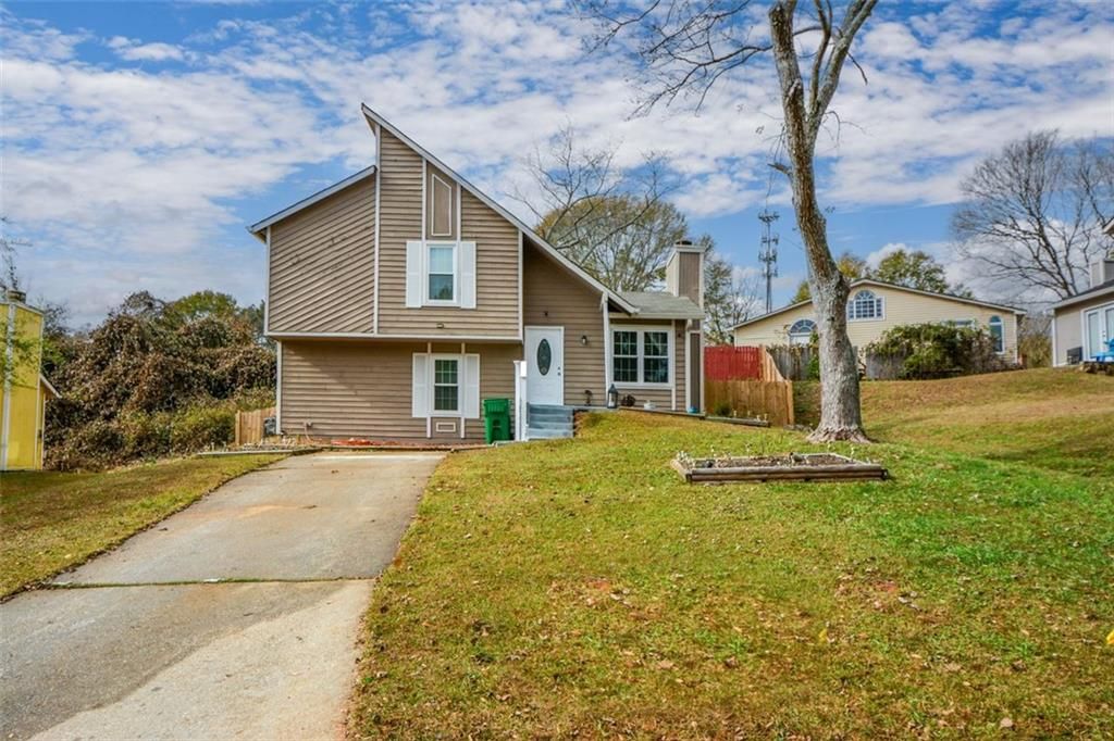 Photo of 1126 Mainstreet Valley Drive, Stone Mountain, GA 30088 (MLS # 7685492)