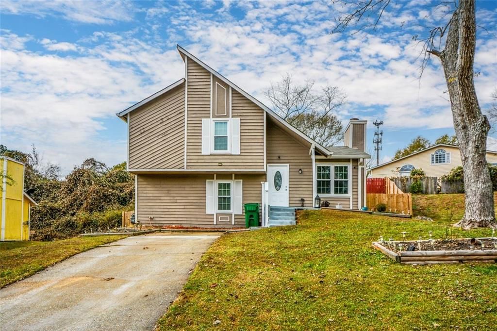 Photo of 1126 Mainstreet Valley Drive, Stone Mountain, GA 30088 (MLS # 7685492)