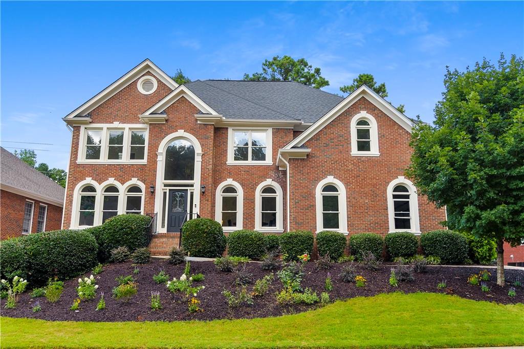Located just 5 minutes from the vibrant restaurants, shops, and events of Downtown Alpharetta, this home has been completely transformed from the ground up-essentially rebuilt with all-new interiors, finishes, and design, offering the look and feel of brand-new construction. Showcasing all new landscaping and once inside boasting six beautifully designed bedrooms and five luxurious bathrooms, every inch of this home has been thoughtfully reimagined-nothing has been left untouched. All-new appliances, pristine hardwood floors throughout, and elevated finishes bring a fresh, modern feel to this timeless property. The grandeur begins at the foyer and flows into a formal dining room adorned with custom moulding throughout. At the heart of the home, the chef's kitchen features an open-concept layout with an expansive island, premium countertops, and state-of-the-art stainless steel appliances, including a gas stove and double ovens-ideal for entertaining and everyday living. The primary suite offers a true retreat with a spa-inspired ensuite featuring a wet room with oversized shower and soaking tub, and a massive walk-in closet. Three additional bedrooms are located on this level-one with an en suite bath, while the other two share a Jack and Jill layout. The finished terrace level provides versatile space for a media room, fitness area, wine cellar, or all of the above. Complete with a bedroom, full bath, and a full kitchen, it's perfectly suited for multi-generational living or hosting long-term guests. Outdoors, established gardens and an expansive yard offer a peaceful oasis for both relaxation and entertaining, complete with an oversized deck and barbecue area. This stunning home is a rare opportunity to enjoy modern luxury in a classic Alpharetta setting. Welcome home.