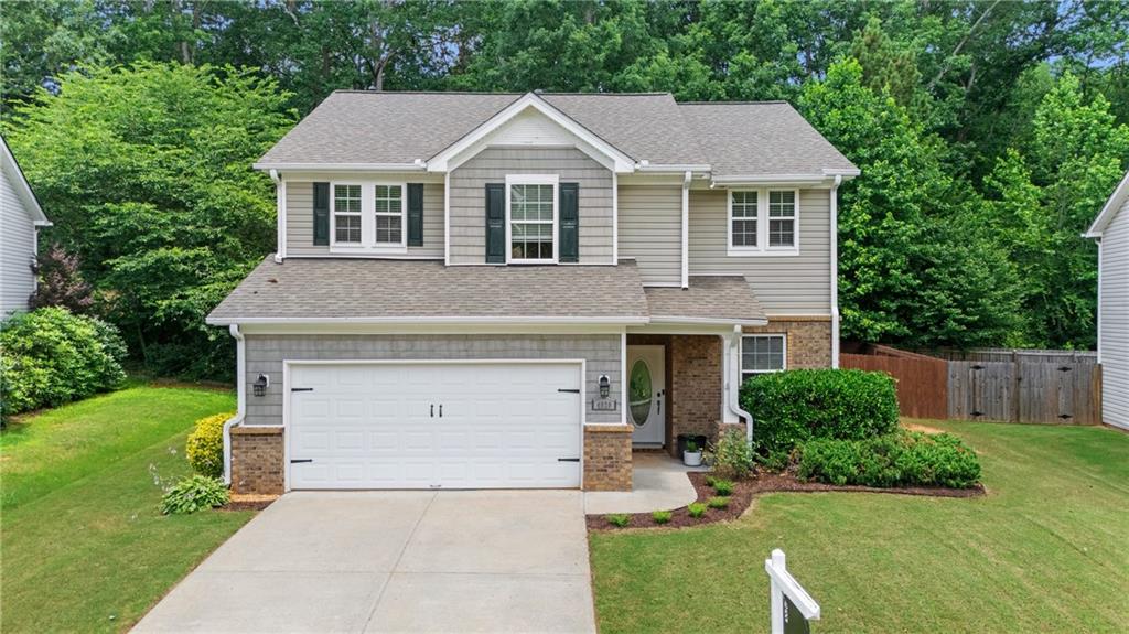 VERY WELL MAINTAINED 4 BEDROOM HOME ON LEVEL CUL DE SAC LOT IN SOUGHT AFTER BRIDGETOWNE SWIM/ TENNIS COMMUNITY! New paint and flooring, New Roof, New HVAC, New Water Heater, TESLA charger in garage. Great attention to detail with Board and Batten accent wall. Open floor plan with room for full size dining table. Kitchen is open to dining and large family room with fireplace. The kitchen has wood cabinets and solid surface counters, a breakfast bar area and stainless appliances including gas range, dishwasher and microwave. Upstairs you'll find 4 bedrooms, one with French doors which makes a great home office. Primary bedroom is large enough for sitting area. Primary bath has separate walk in shower and garden tub, tiled shower and floors and large walk in closet. The level backyard is fenced and ready for fun with fire pit area and room for gardens or pets. Bridgetowne is known for their amenities including clubhouse, Jr Olympic Pool, lit Tennis courts, Basketball court, and Park. You'll love the location of Bridgetowne, right off of GA 400 and close to Publix, great restaurants, Starbucks and more coming soon! New shopping center coming soon right off of GA 400. Easy access to Lake Lanier and Dawsonville as well for shopping including the outlet mall. Top Forsyth County Schools are close by. There is much to love about this home, community and area. Welcome home...