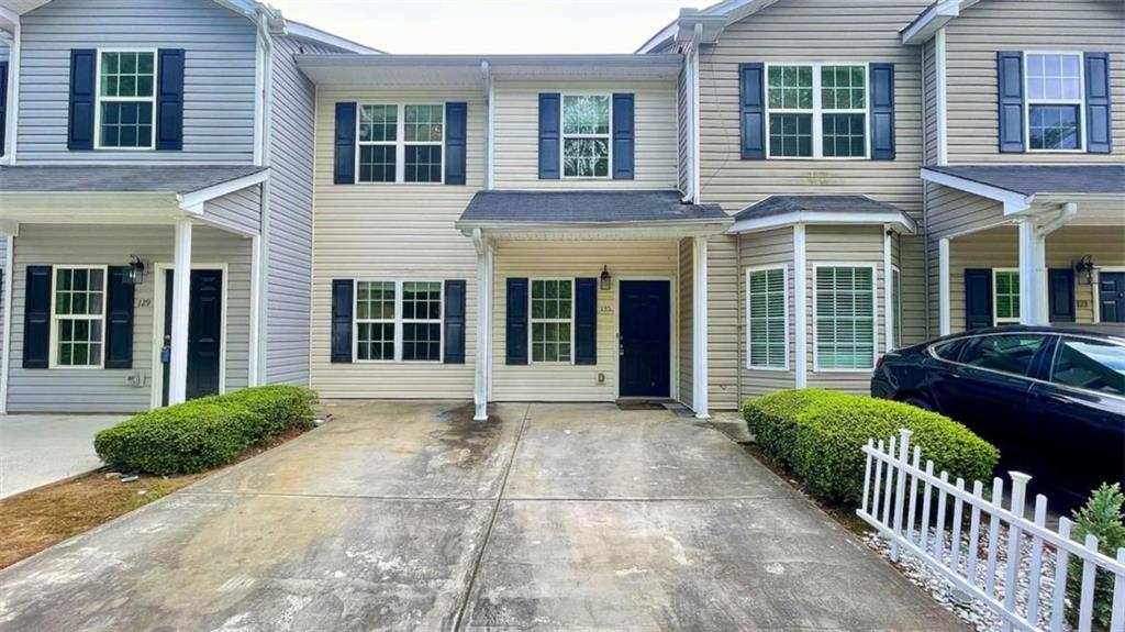 Spacious 3BR/2.5BA Townhome in the Heart of Hiram! Tucked away in a quiet, well-maintained community just minutes from Downtown Hiram, this roomy townhome offers comfort and convenience in an ideal location. Step inside from the welcoming front porch stoop into a large, open-concept living and dining area that flows seamlessly into a bright kitchen featuring stained wood cabinetry, a walk-in pantry, generous breakfast bar, LVP flooring, and included black/stainless steel appliances (range, dishwasher, and microwave) along with a small private patio in the back, perfect for a grill and a couple of chairs. Upstairs, you’ll find a spacious primary suite with an en suite bathroom, two additional bedrooms, a second full bath, and a laundry closet for added convenience. Parking is a breeze with a dedicated 2-car parking pad right out front. This home is perfectly situated near local dining, shopping, and groceries—including Walmart—and offers easy access to everything downtown Hiram has to offer. Simple application process. yard maintenance, trash, water included. Contact us today for more details or to schedule a showing!