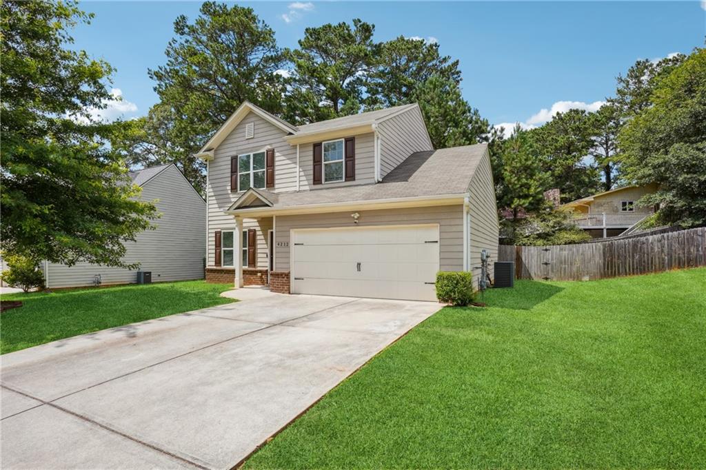 Welcome to your perfect home located in Semaphore Crossing . Home including garage has been freshly painted. New updates are enlarged kitchen island that sits 6 or more. Central Heating and Air conditioner unit is one year old and Hot water tank is 2 years old. This inviting 3 bed 2.5 bath home boasts an open floor plan that is perfect for entertaining. The hardwood floors throughout the home add a touch of elegance. The main level is equipped with an extra family room, half bath, two car garage, a kitchen with an island. The upper level includes three bedrooms, two full baths and a laundry room. The backyard is an ideal place for the whole family to gather for outdoor activities.