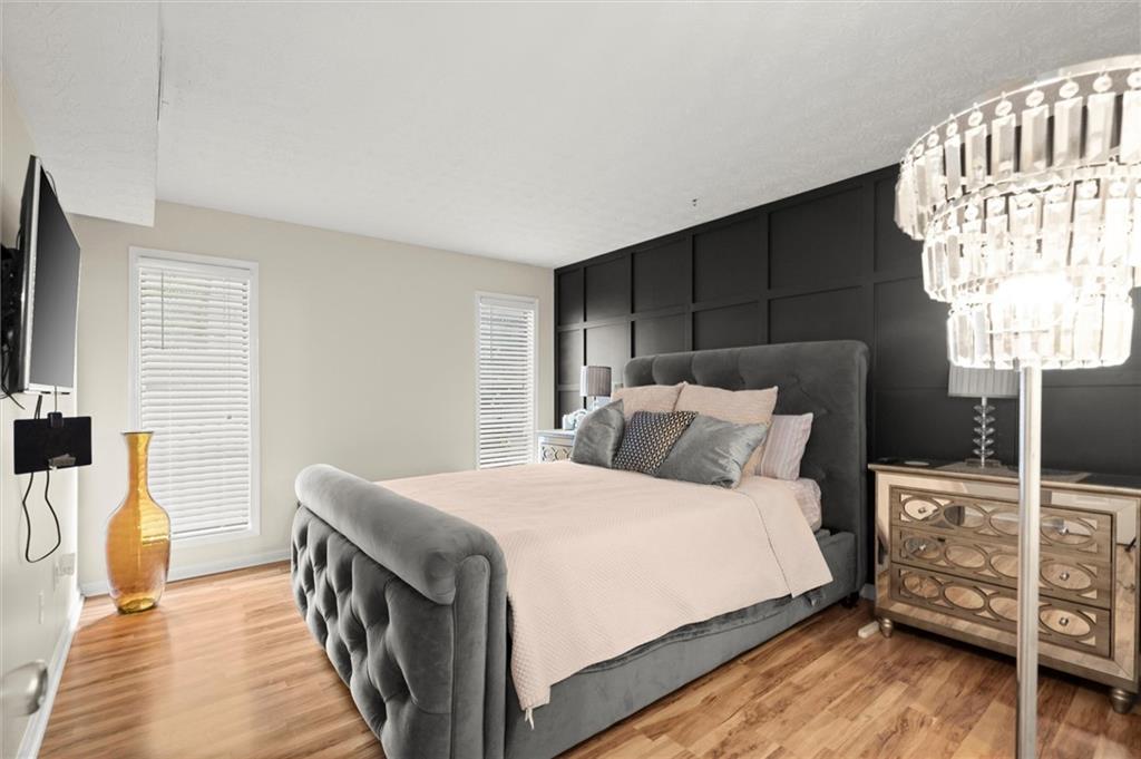 Welcome to Woodridge, your Perfect Condo Retreat in Tucker! Discover easy living in this beautifully updated and maintained 2 bedroom, 2 bathroom first-floor condo tucked inside the desirable Woodridge community near Chamblee. Offering convenience, comfort, and charm, this home is ideal for anyone looking for a stylish, low-maintenance lifestyle. With a thoughtfully designed layout, modern updates, and abundant natural light, this home is the perfect blend of comfort and convenience.The inviting family room with fireplace flows effortlessly into the dining area and a sun-drenched bonus room, this could be ideal as a home office, reading nook, or flex space. The kitchen offers generous cabinet storage, plenty of counter space, and connects seamlessly for everyday living and entertaining. Retreat to the spacious primary suite, complete with a huge walk-in closet and a private en suite bath. The secondary bedroom also boasts a large walk-in closet, ensuring ample storage for everyone. Throughout the home you’ll find an updated, extremely well-maintained interior that’s truly move-in ready.
Ownership here is effortless as the monthly HOA covers water, trash, landscaping, and exterior upkeep, including painting and roof maintenance when needed, so you can enjoy peace of mind. The gated community features top-notch amenities: a sparkling swimming pool, pickleball court, picnic and fire pit areas, and beautifully landscaped grounds.