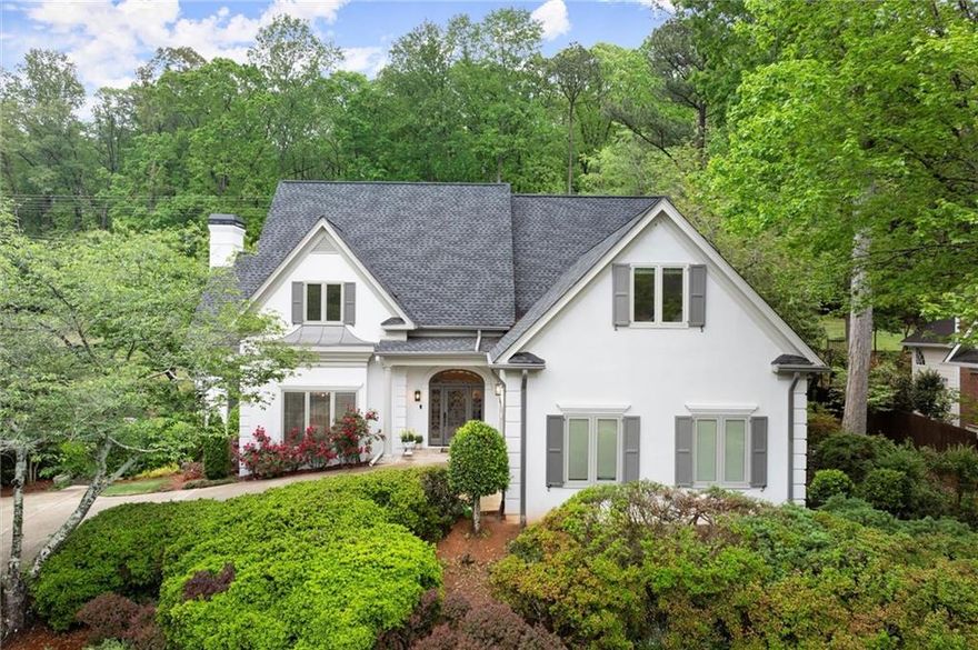 GEM in EAST COBB - completely updated home in the sought-after Waterford Green community and top-rated school district. Nestled against the Chattahoochee National Park with the Gold Branch Trail just steps from your backyard, this home offers exceptional privacy, natural beauty, and everyday convenience. Over the past year, this property has been extensively upgraded, adding more than 1,000 square feet of finished space and a long list of high-quality improvements. Updates include a new architectural roof, freshly painted hard coat stucco, fresh interior paint, designer lighting, and new hardwood flooring and many more! A grand foyer opens into the main living space, composed of a formal dining room and a two-story great room that connects seamlessly to the sunroom. The newly installed modern folding glass door is a show-stopper, bringing in abundant natural light and enhancing the connection to the outdoors. The kitchen is a standout, featuring quartz countertops, floor-to-ceiling cabinetry, a new Samsung gas cooktop, upgraded hardware, built-in appliances, and a breakfast nook overlooking the peaceful backyard. The main level includes a spacious Primary Suite with a luxurious bathroom—featuring an oversized MTI soaking tub, walk-in shower, double granite-topped vanities, heated tile floors, and a large walk-in closet. Also, on the main level is a beautifully renovated guest bath with smart home features, a full-sized laundry room with utility sink, and a private home office with custom built-ins. Upstairs, you’ll find four generously sized bedrooms and two full bathrooms—including a Jack-and-Jill layout and a second updated guest bath—offering plenty of space for family or guests. The finished terrace level is designed for flexibility and entertainment, featuring a media viewing room, an additional flex space ideal for an office or guest bedroom, a large open area for multiple uses, a full bathroom, and a newly completed, fully equipped bar room with a fresh modern finish. The walk-out covered patio completes the terrace level. Outside, the Brazilian Koa wood deck overlooks a professionally landscaped yard. Additional parking on the driveway adds convenience for guests or multi-car households. Waterford Green offers outstanding HOA amenities right across the street, including a swimming pool, clubhouse, two ALTA tennis courts, a basketball court, and a playground. The location also provides easy access to Roswell, Sandy Springs, and the East Cobb lifestyle. Schedule your tour today to experience this exquisite home with modern comfort and refined updates in East Cobb’s Waterford Green!