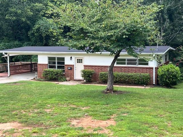 This one will not last long. What a great opportunity to own a 4-sided brick home in a quiet little community with no HOA and just about a mile from Old Town Conyers. This place is just adorable and has so much potential. The roof, floors and interior paint are all brand new. It has a great side porch to sit and enjoy your morning coffee or evening drinks of choice or sit on the back porch and look out over the 1.79 acres while soaking up the peace and serenity. Washer, dryer, and refrigerator stay with the house (and all other furnishings are negotiable!). This place is just perfect and won't last long so schedule your showing today!! Do not approach home without an appointment.