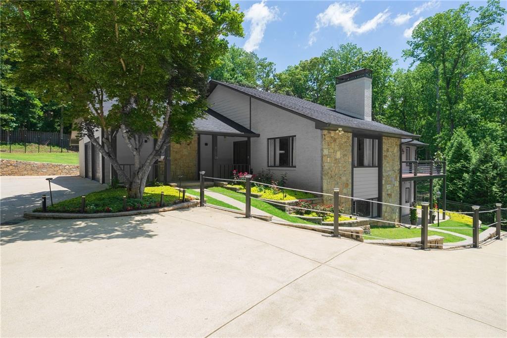 Discover this unique and beautifully renovated ranch-style home with a full finished basement including in-law suite, perfectly nestled on a serene 1-acre lot. Boasting a real open floor plan and a wealth of upgrades and customization, this home offers space, comfort, and versatility for modern living and meticulous care throughout. Chef's Kitchen is spacious and equipped with custom cabinets each with a unique design inside, stylish counters, New double oven, gas cooktop,and a large walk-in pantry perfect for culinary enthusiasts. On the main level you will be amazed by the beautiful solid bamboo floors, 3 generously sized bedrooms, including a luxurious master suite with balcony access, a walk-in closet, and a fully renovated spa-like master bath with a sleek design. The 2nd bath is renovated as well with double vanity and tile flooring. There is also a dedicated office workspace on the main level and a powder room convenient for guests. The large dining room opens to a huge living room with windows all around and a beautiful white stone fireplace. A Wood-Detail Staircase creates an elegant centerpiece connecting the home’s levels. Terrace level features additional living space includes 2 bedrooms, 2 full renovated bathrooms, and a huge living room with a 2nd fireplace that leaves enough room for a game room, media room or a flex room. There are also versatile areas that can be used as a Workshop, studio, office, Gym, and plenty of storage. Terrace level provides direct exterior access to the professionally landscaped backyard, designed and maintained for year-round beauty. Walk out Backyard from main level is flat, grassy and ideal for volleyball, a large pool, or any recreational activity. Multiple outdoor spaces for gatherings, BBQs, and relaxation. On top of the 2-car attached garage, there is ample parking space for 8 vehicles, RVs or large tracks, including turnaround capability. Two brand-new HVAC systems have been installed. Conveniently located close to the Hwy 141 corridor in Johns Creek offering shopping, entertainment, parks and restaurants nearby. Excellent top rated schools include Johns Creek HS, Autry Mill MS and State Bridge crossing elementary. This home is a rare gem. Schedule your showing today!