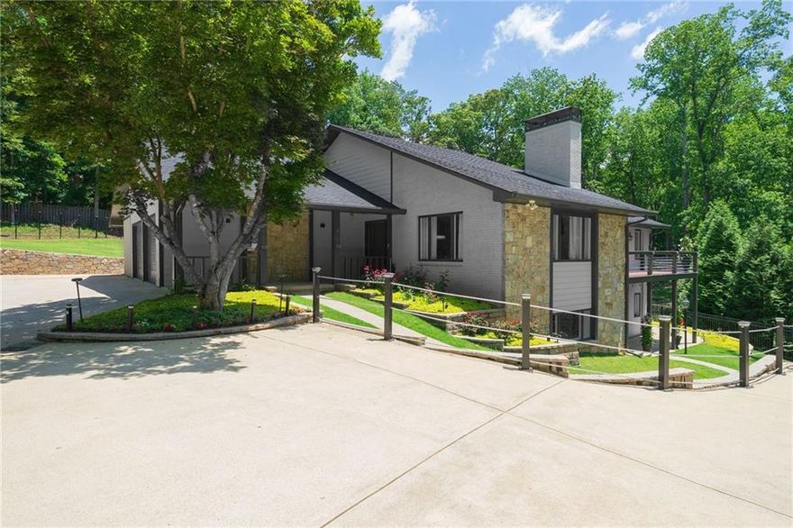 Discover this unique and beautifully renovated ranch-style home with a full finished basement including in-law suite, perfectly nestled on a serene 1-acre lot. Boasting a real open floor plan and a wealth of upgrades and customization, this home offers space, comfort, and versatility for modern living and meticulous care throughout. Chef's Kitchen is spacious and equipped with custom cabinets each with a unique design inside, stylish counters, New double oven, gas cooktop,and a large walk-in pantry perfect for culinary enthusiasts. On the main level you will be amazed by the beautiful solid bamboo floors, 3 generously sized bedrooms, including a luxurious master suite with balcony access, a walk-in closet, and a fully renovated spa-like master bath with a sleek design. The 2nd bath is renovated as well with double vanity and tile flooring. There is also a dedicated office workspace on the main level and a powder room convenient for guests. The large dining room opens to a huge living room with windows all around and a beautiful white stone fireplace. A Wood-Detail Staircase creates an elegant centerpiece connecting the home’s levels. Terrace level features additional living space includes 2 bedrooms, 2 full renovated bathrooms, and a huge living room with a 2nd fireplace that leaves enough room for a game room, media room or a flex room. There are also versatile areas that can be used as a Workshop, studio, office, Gym, and plenty of storage. Terrace level provides direct exterior access to the professionally landscaped backyard, designed and maintained for year-round beauty. Walk out Backyard from main level is flat, grassy and ideal for volleyball, a large pool, or any recreational activity. Multiple outdoor spaces for gatherings, BBQs, and relaxation. On top of the 2-car attached garage, there is ample parking space for 8 vehicles, RVs or large tracks, including turnaround capability. Two brand-new HVAC systems have been installed. Conveniently located close to the Hwy 141 corridor in Johns Creek offering shopping, entertainment, parks and restaurants nearby. Excellent top rated schools include Johns Creek HS, Autry Mill MS and State Bridge crossing elementary. This home is a rare gem. Schedule your showing today!