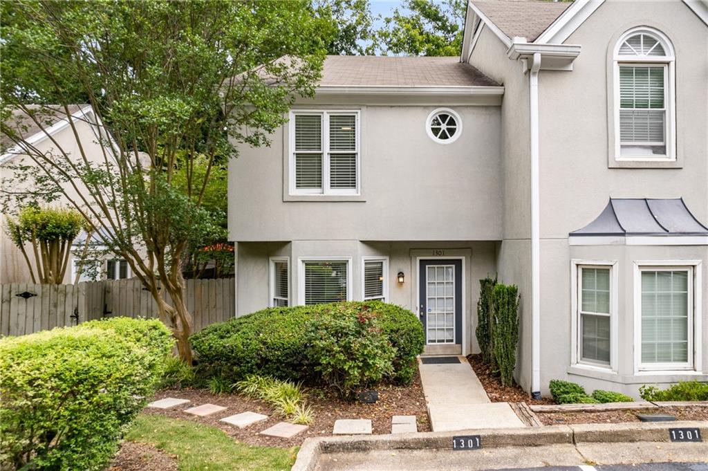 Welcome to Defoors Landing In Underwood Hills! This gated boutique townhome community offers all the convenience of trendy West Midtown living & a community pool. As you enter the foyer you will discover a bright open concept main level with an eat-in kitchen complete with a bay window, granite countertops, and updated lighting. The kitchen overlooks the large fireside living/ dining room with hardwoods throughout and a powder room for guests. The living room opens to a fantastic patio and rare private fenced-in yard, perfect for outdoor entertaining and pets! Head upstairs to find a primary bedroom with an en-suite bath and a spacious secondary bedroom with an en-suite bathroom and walk-in closet. The laundry room is conveniently situated on the upper level. Do not miss this opportunity to live in Atlanta’s West side near developments such as The Works- Upper West Side Atlanta, Star Provisions, new breweries, the Beltline, Bellwood Quarry, and many great restaurants and retail shopping venues! Easy access to Midtown, Buckhead, Westside, and all major interstates. Short drive to airports! 2 designated parking spaces in front of the unit. The seller replaced the entire electrical panel of the home during ownership. Rentals Allowed.