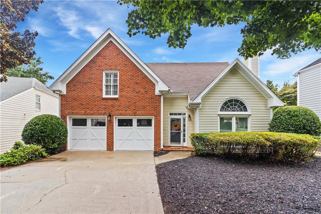 This elegant master-on-the-main home boasts an open floor plan that effortlessly integrates the living spaces, making it ideal for both entertaining and everyday living. Upon entry, you’ll be greeted by soaring ceilings and an abundance of windows that flood the great room with natural light. The eat-in kitchen is a chef’s dream, featuring stainless steel appliances, quartz countertops, custom shelving, freshly painted white cabinetry, and a convenient pantry. Large windows enhance the bright and welcoming atmosphere. The separate dining room overlooks the spacious fireside great room, creating a seamless flow between spaces.
The primary bedroom, located on the main level, offers wood flooring, a walk-in closet, and a tray ceiling. It provides direct access to the expansive, fenced back patio—perfect for morning coffee or evening relaxation. The en-suite primary bathroom features double vanities, a soaking tub, and a separate shower.
Upstairs, you’ll find two generously sized bedrooms that share a Jack and Jill bathroom, as well as a cozy landing or loft area, ideal for a reading nook or home office. The home is complemented by fresh neutral paint throughout, creating a serene and cohesive atmosphere. Situated on a level cul-de-sac lot, this property offers a tranquil retreat while remaining conveniently close to shopping and parks. Additional features include zoned HVAC, a security system, and double-pane windows. Meticulously maintained and move-in ready.