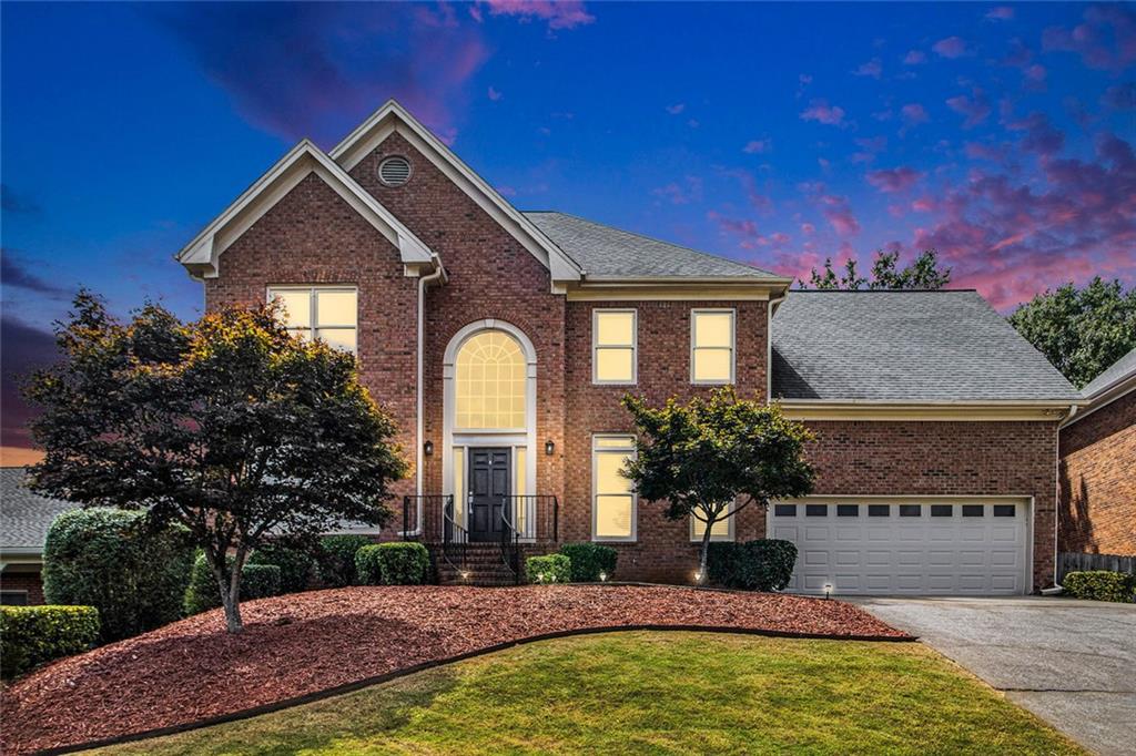 Welcome to this exquisite property located in Johns Creek, GA, ranked "#1 Best Place to Live" by U.S. News & World Report. This masterpiece embodies elegance and sophistication in every corner. As you approach, you are greeted by a stunning façade that combines architectural beauty with tasteful landscaping, inviting you to explore the wonders that lie within. The meticulously manicured gardens create a serene atmosphere, making this residence a peaceful retreat from the hustle and bustle of everyday life.
Upon entering the grand foyer, you are immediately struck by the sense of spaciousness and light, with high ceilings and abundant natural light pouring in from large windows that frame the vista of the outdoors. The interior decor is characterized by a harmonious blend of contemporary design and classic touches, offering a warm and welcoming ambiance.
The generously sized living room serves as the heart of the home, featuring an impressive fireplace that serves as a focal point, perfect for cozy evenings spent with family and friends. Adjacent to this space, the open-concept dining area provides an ideal setting for memorable gatherings, where laughter and conversation flow effortlessly.
The gourmet kitchen is a chef's dream, equipped with state-of-the-art appliances and ample counter space that allows for culinary creativity. Sleek cabinetry elevates the functionality of this area while contributing to its modern aesthetic. Whether preparing a casual breakfast or hosting a lavish dinner party, this kitchen accommodates it all with ease.
As you venture further into the home, you will discover multiple well-appointed bedrooms, each thoughtfully designed to provide privacy and tranquility. The master suite is a true sanctuary, boasting a luxurious ensuite bathroom complete with a soaking tub, dual vanities, and exquisite finishes. Each additional bedroom offers its own unique charm, providing comfortable and inviting spaces for guests or family members.
Stepping outside, the backyard is an entertainer's paradise, featuring a spacious deck area ideal for cookouts and gatherings under the stars. The backyard is perfect for outdoor activities or simply enjoying the fresh air in your own private oasis.
Additionally, this property offers convenient access to local amenities, ensuring that everything you need is within reach. Whether you are basking in the beauty of your surroundings at home or exploring the vibrant community nearby, this residence invites you to experience a lifestyle of comfort and sophistication. This stunning property is not just a house, but a place to call home.