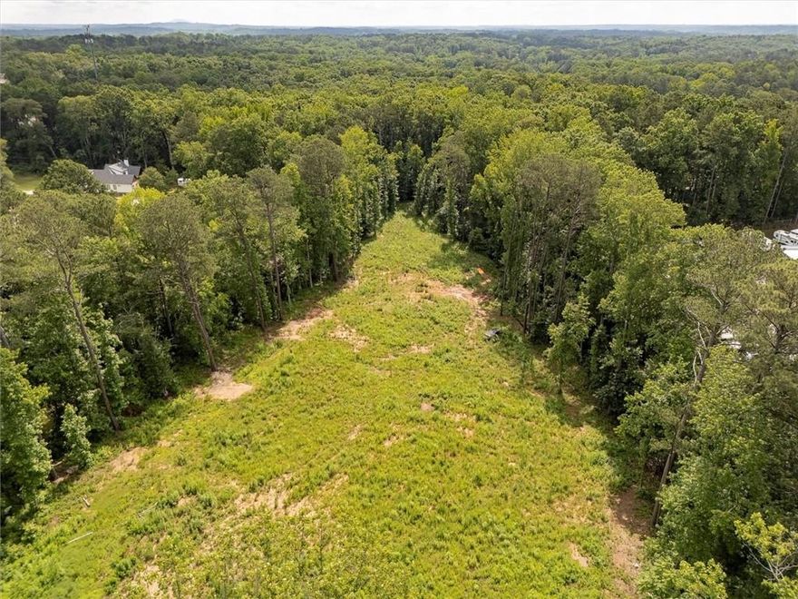 Excellent opportunity to build your dream home!!! 3.26 acres zoned R80 in the prime location of Woodstock close to HWY 140 with easy access to Milton/Roswell/Alpharetta and Canton. No HOA. Property is mostly cleared with utilities available! Located in the desirable Avery/Creekland/Creekview school district!