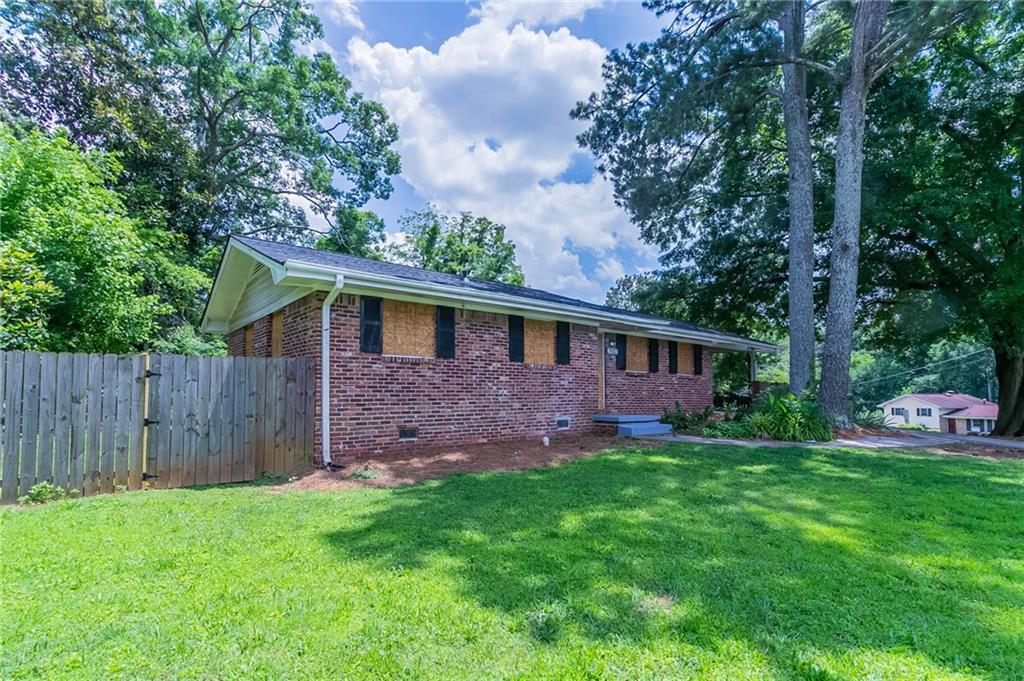 Welcome to this beautifully maintained 3-bedroom, 2-bathroom single-story home that combines style, comfort, and functionality. Step inside to find a bright and airy interior featuring elegant hardwood and tile flooring throughout. The heart of the home is the modern kitchen, complete with sleek white cabinetry, stunning stone countertops, and stainless steel appliances — perfect for home chefs and entertainers alike.
The open floor plan flows effortlessly, providing a seamless connection between the living, dining, and kitchen areas. Both bathrooms are tastefully updated, offering comfort and convenience for everyday living.
Outside, enjoy the expansive, fully fenced backyard—ideal for pets, play, or weekend gatherings. The covered carport provides convenient parking and additional storage space.
Located in a desirable neighborhood, this move-in ready gem is close to shopping, dining, and schools. Don’t miss your chance to make this home yours!
