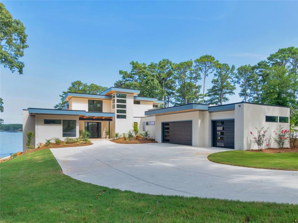 Stunning New Construction on Lake Spivey Don't miss this rare opportunity to own the only new construction available on beautiful Lake Spivey! Perfectly positioned on one of the lake's premier lots, this home boasts over 250 feet of waterfrontage, offering sweeping lake views, a private beach, two docks, and multiple outdoor living spaces designed for lakeside luxury. Whether you're soaking in the saltwater pool, relaxing in the hot tub, or enjoying sunsets from the great room, kitchen, or one of the many rooms with breathtaking views - every corner of this home is crafted for comfort and connection with nature. Lake Spivey is the only private lake of its size in the Southeast that allows water sports - including wakeboarding, wake surfing, wave runners, fishing, and more. Spend your evenings cruising the lake or simply unwinding by the water's edge. Located just minutes from I-75 and I-285, and less than 30 minutes to Atlanta Airport and downtown, this home offers the perfect blend of lakeside serenity and urban convenience. This is more than a home - it's a lifestyle. Come experience it for yourself.