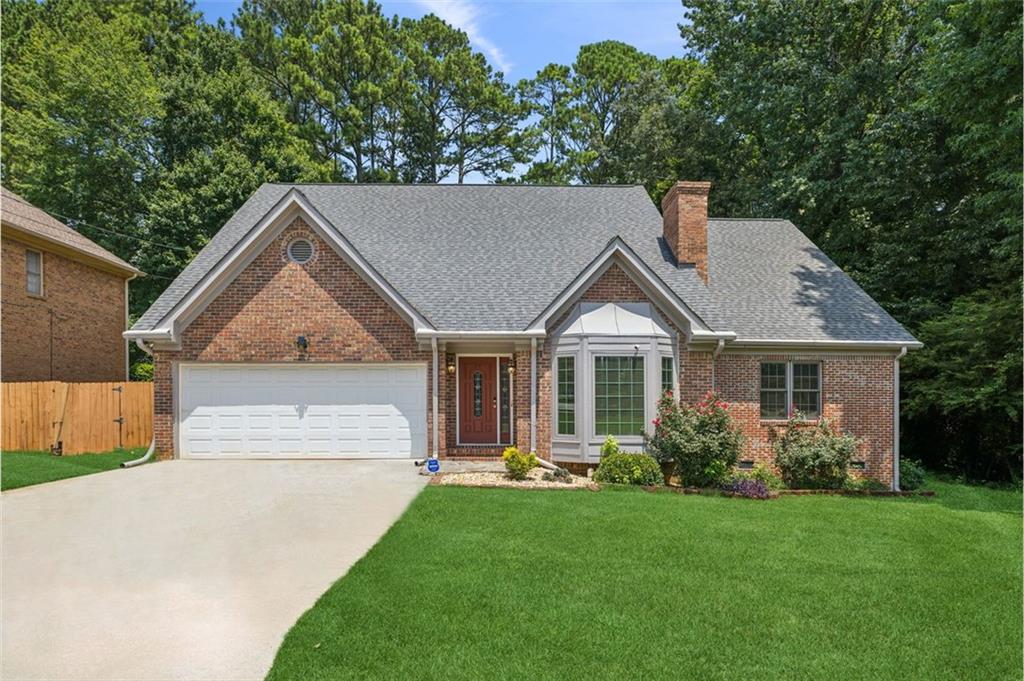 Welcome home to this beautiful & spacious four-sided brick home. This 3 bedroom, 3 bath home offers you an open concept as you enter the home into the traditional formal living area which opens to the dining area. You then enter into the updated kitchen with a large island that presents with lots of storage space and a coffee/bar area. The owner's suite is on the main and provides a bathroom with separate shower, tub, and double vanity. All 3 bathrooms have been
recently updated/renovated. You also must see the newly added addition which leads to a large family room, plus additional space that can be used as an office or workout room which opens to a large deck.