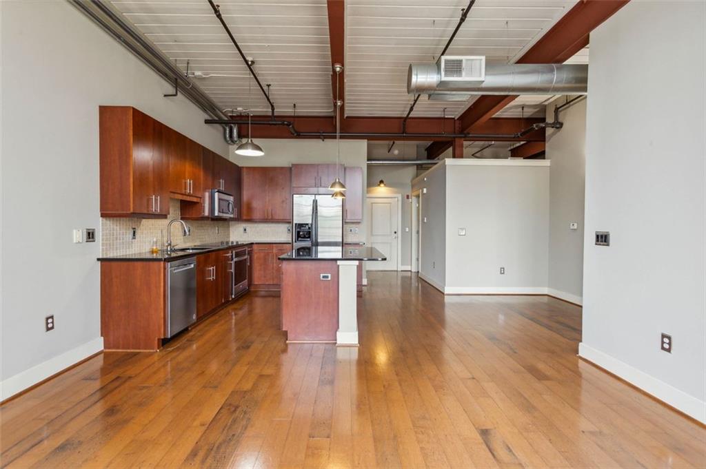If intown loft living has been your dream, now is the chance to call this beauty home. The floor to ceiling windows offers tons of natural light. The industrial touches of the exposed brick, steel beams, and exposed duct work will have you feeling like you are living in a piece of history right in the middle of Atlanta. The Open concept design offers a welcoming space for entertaining guests. The kitchen features all new stainless steel appliances, a huge granite island, under mount cabinet lighting and tons of prep space for your inner chef. Master suite offers dual vanities and a separate shower and soaking bathtub. Secondary bedroom is very spacious and perfect for guest. Stackable washer and dryer. Huge terrace with a view to the Edgewood retailers is the perfect space to enjoy your morning coffee or simply people watch. There is 1 designated covered parking space but a ton of guest parking. Just a few steps outside and have all your shopping needs right in your backyard: from boutique retailers, to grocery store runs at Kroger, to binge shopping at Target. Little Five Points is an easy half mile up Moreland Avenue and Atlanta’s iconic Krog Street Market and Atlanta Beltline access is just a short 1.5 miles. Intown loft living at it's finest!
