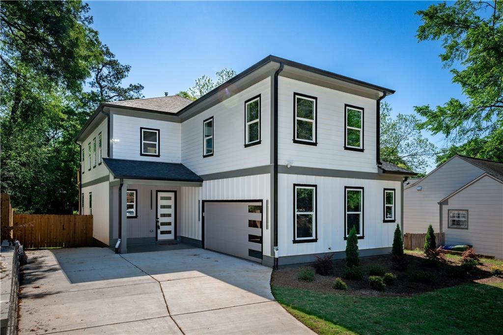 An incredible NEW HOME in the heart of East Lake! Boasting 4 spacious bedrooms and 3.5 Bathrooms this open concept floorplan is incredible! Chef's kitchen with quartz countertops, custom cabinets, and stainless steel appliances are the perfect place to entertain or cook dinner for the family! LIVE LIFE outdoors year round on the incredible back deck that leads out to the flat and HUGE back lawn and gardens. Retreat to the primary suite with a sitting area, private outdoor deck, spa like luxury bath, and GIGANTIC owners walk in closet! The 2nd level is rounded out by a lofted 2nd living room, 2 bedrooms and a jack & Jill bath. The main floor also enjoys a 2nd Primary Suite perfect for guests, in-laws, or a deluxe home office with a full bathroom! A TWO car garage welcomes leads right into a mudroom and the main living area. WALK EVERYWHERE...just a few steps out your front door to 2nd+Hosea, Oakhurst Village, Drew Charter School, East Lake YMCA, Downtown Kirkwood, and Bessie Branham Park...BRILLIANT!