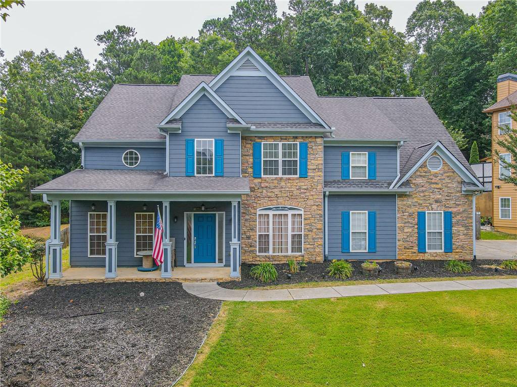 Welcome to your dream home in the heart of Buford! This stunning craftsman style residence offers the perfect blend of modern amenities and timeless elegance. With 4 bedrooms, 2.5 bathrooms, and a host of incredible features, this home is sure to impress. As you step inside, you'll immediately notice the attention to detail and the fresh interior paint that enhances the welcoming ambiance throughout. The spacious living area is perfect for entertaining friends and family, with a seamless flow into the dining area and kitchen. Speaking of the kitchen, it's a chef's delight! Boasting sleek stainless steel appliances, ample counter space, and plenty of storage, this is where culinary dreams come to life. Prepare delicious meals with ease and gather around the breakfast bar for casual dining. The upper level of the home is dedicated to rest and relaxation. The new carpet upstairs adds a touch of luxury to the four well-appointed bedrooms. The oversize master suite is a true oasis, featuring a huge walk-in closet and a private bathroom with all the comforts you desire. But the features don't end there! This home offers a man cave garage, the perfect space for your hobbies, a home gym, or simply a retreat for relaxation. There's plenty of room to create the ultimate space tailored to your preferences. Location is everything, and this home has it all. Just a stone's throw away from Lake Lanier, you'll have easy access to a boat ramp, allowing you to spend sunny days on the water. Nearby boat and RV storage ensures convenience and peace of mind. And with downtown Buford less than two miles away, you'll have endless options for shopping, dining, and entertainment. Experience the vibrant nightlife and immerse yourself in the thriving community. Don't miss the opportunity to make this craftsman-style gem your own. Schedule a showing today and embrace the luxurious lifestyle that awaits you in this Buford beauty.