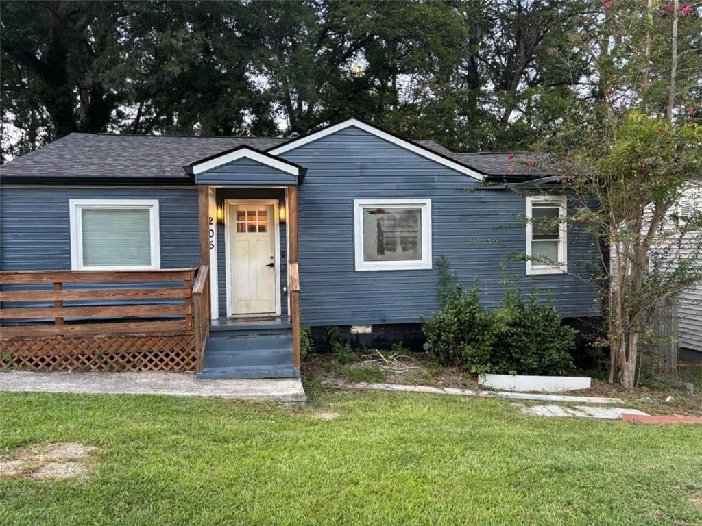 Make Hapeville your home with this beautifully remodeled ranch-style residence-3 bedrooms, 2 full bathrooms, and approximately 1,160 sq ft of living space, originally built in 1950. Gleaming solid wood floors flow throughout, and the new chef's kitchen features granite countertops, tile backsplash and flooring, stainless steel appliances, a center island, and a convenient laundry center. The sizable front porch, complete with lighting and fans, invites you to relax and unwind. The owner's suite offers a designer soaking tub plus a separate shower, while the guest bath dazzles with a glass-enclosed shower. Outdoors, enjoy a full garage, a large rear yard suitable for a tiny house or future expansion, and plenty of parking. Ideally located near I-75, I-85, and I-285, it's about 10 minutes to Atlanta's Airport and approximately 15 minutes to Downtown's dining and entertainment.