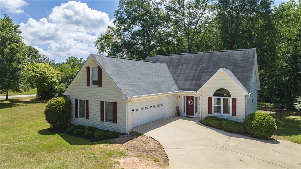 Stunning property located In Oconee County and zoned for North Oconee High School!! The 4 bedroom and 2.5 bath home has been meticulously maintained over the years. With 2,500 sqft, this home has a spacious floor plan with an updated kitchen, separate dining room, LVP flooring, new windows with lots of natural light, plantation shutters, high ceilings, laundry room and an encapsulated crawl space. Master suite is on the main level and features a double vanity, garden tub, walk-in closet and your own private entrance to the oversized deck, overlooking the private 1.18 acre lot. Desirable location right down the street from Dove Creek Elementary School, Striplings and Hwy 78. This beautiful home, located in a well-established neighborhood with no HOA, is a must see!! Schedule a showing today!