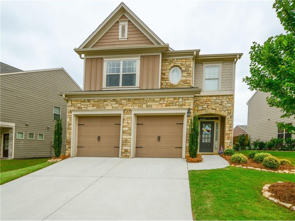 Welcome to Stonehaven Pointe, where luxury living and convenience converge seamlessly. This magnificent 5-bedroom, 3-bathroom home nestled in a vibrant Swim/Tennis/Playground community offers the epitome of comfort and functionality. Upon entering, you're greeted by expansive hardwood flooring that exudes warmth and sophistication throughout. The modern stainless steel appliances in the kitchen perfectly complement the sleek granite countertops found in both the kitchen and bathrooms. Escape to the sumptuous master bedroom, featuring a spacious sitting area ideal for relaxation. A walk-in laundry room adds convenience to your daily routine, while vaulted ceilings in all bedrooms create an airy ambiance. Outside, a private backyard oasis beckons, complete with a cozy sitting area—perfect for entertaining or enjoying quiet moments. Located in the highly regarded Forsyth school district, this home offers easy access to GA-400 for effortless commuting and is just minutes away from shopping centers and amenities. Don't let this opportunity slip away. Schedule a viewing today and make this exquisite residence your own.