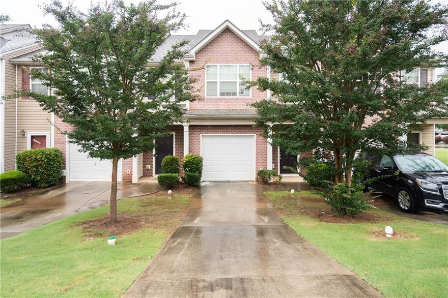 Welcome to 6010 Capitol Knoll - a charming, well-kept brick-front townhouse located in the heart of Fairburn, GA. Offering a comfortable layout and low-maintenance living, this home is move-in ready and full of value.    Step inside to an open-concept main level featuring a cozy family room with a fireplace and custom built-ins, ideal for quiet evenings or entertaining guests. The blend of hard surface flooring and plush carpet adds both warmth and practicality to the living space.    The kitchen is well-equipped with granite countertops, black appliances, a breakfast bar with seating, and ample cabinetry for storage. Whether you're preparing a weeknight dinner or hosting friends, this space works beautifully.    Upstairs, you'll find two spacious bedrooms with soft carpet and en-suite bathrooms, providing privacy and comfort for residents and guests alike. Fresh interior paint throughout adds a clean, modern touch.    Enjoy added convenience with a one-car garage, private driveway, and mature landscaping-professionally maintained by the HOA for easy, stress-free curb appeal.     Prime Location Highlights:   * Minutes from the Georgia Renaissance Festival and historic downtown Fairburn   * Close to Grady South Fulton (currently under construction)   * Easy access to I-85, shopping centers, dining, and everyday essentials   * Near local parks and green space for outdoor enjoyment    Whether you're a first-time buyer, downsizing, or looking for a smart investment property, 6010 Capitol Knoll offers a perfect blend of comfort, value, and location. Schedule your private tour today!