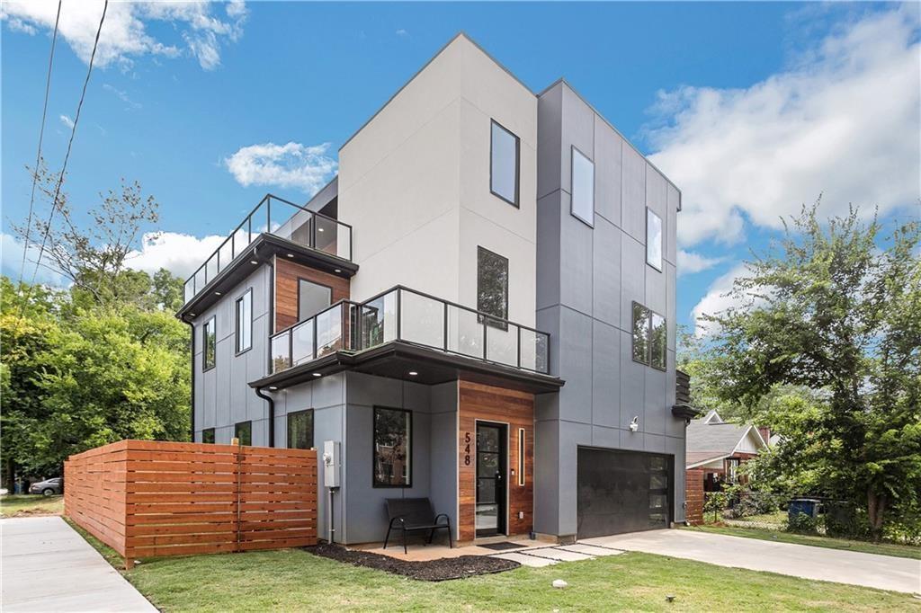 This is custom home that you do not want to miss ! Absolutely great for the savvy investor who would like to use the home as a content house or an event space. The home has a very unique flair that is really one of a kind. OPEN CONCEPT floor plan welcomes you into the living room with a cozy fireplace and statement wine wall. Enjoy the newer 3 level construction home that has a great over sized Primary Bedroom on the top floor with a walk out rooftop perfect for unwinding and relaxing the day away!! Main floor has a guest suite + full bath for your overnight guests.