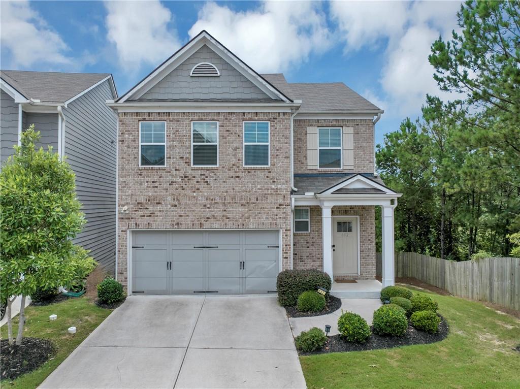 Welcome to this stunning residence located in a quiet, gated community. This meticulously maintained home blends modern sophistication and functionality. The open concept floor plan on the main floor combines a bright living, dining and kitchen area.
The kitchen is equipped with stainless steel appliances, including a refrigerator, and features beautiful white kitchen cabinets in combination with a spacious island with quartz countertops.
Upstairs, the primary suite serves as a true sanctuary, completed with an elegant tray ceiling and a generous walk-in closet. A master bathroom include double vanity, soaking tub, and a separate shower. The two additional bedrooms are situated away from the primary bedroom. A laundry room is thoughtfully located on the second floor. The property includes an unfinished walk-out basement, presenting endless possibilities for customization. A standout feature of this house is its private backyard.
Residents can enjoy a variety of community amenities including a pool, playground, picnic area, and a clubhouse. The HOA covers all exterior maintenance, including roof and lawn care, ensuring a hassle-free living experience.
Conveniently located near I-285 and I-20, this property offers unmatched access to city life, all Atlanta attractions, and the airport.