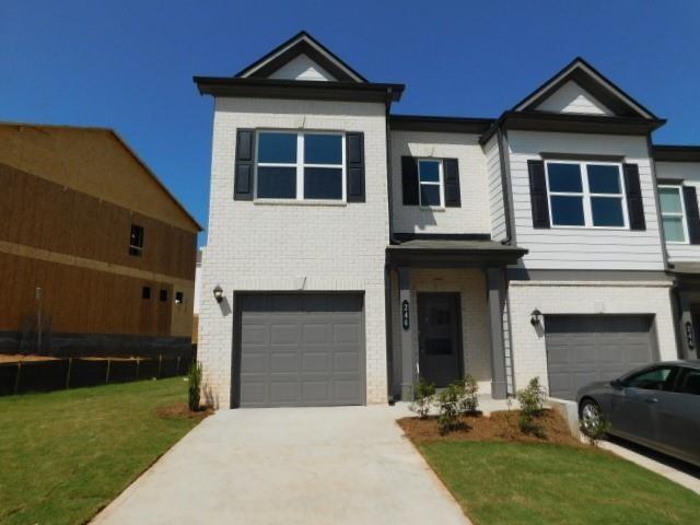 One year old end unit town home. Main floor has luxury vinyl planking. Enter into a foyer where there is a half bath that leads to a living room. In the rear of the home there is the kitchen with grey cabinets, Granite counters, stainless appliances, and walk-in pantry. There is a dining area with access to the rear patio. There is also access on the main level to the 1-car garage with auto-opener. The upper level features a laundry room with washer/dryer hook-ups. There are two spare bedrooms and a full hall bath with tub/shower combination. The master bedroom has a walk-in closet. The master bath has dual vanities, walk-in shower and linen closet. HOA handles the landscaping. No aggressive dog breeds. Close proximity to dining & shopping. Blinds have been installed on the windows. Ask about move-in special.