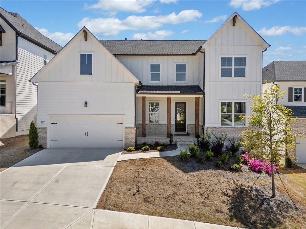 PRICE ADJUSTED!! Welcome to this North Facing like-new dream home in the sought-after Easley community! Perfectly situated on a thoughtfully landscaped lot, this exquisitely designed home blends modern style, quality craftsmanship, and resort-style amenities — all in a prime location just minutes from outdoor adventure, downtown shops, and top-rated schools. Step into a grand two-story foyer where sleek hardwood floors lead into a bright, open main level designed for stylish everyday living. The chef’s kitchen is the heart of the home, featuring a quartz-topped island with breakfast bar, vent hood, built-in oven and microwave, herringbone tile backsplash, and abundant cabinetry. The kitchen flows into a welcoming family room anchored by a brick fireplace — perfect for gathering with family and friends. A dedicated office on the main floor offers a quiet retreat for work or study. The open dining area comfortably seats 12+ and leads to a charming back deck overlooking a well-maintained backyard — ideal for entertaining and outdoor dining. Upstairs, the expansive primary suite includes a beautiful tray ceiling, plush carpet, walk-in closet, and a spa-like bath with double vanities, soaking tub, and separate tiled shower. Three additional bedrooms, a large laundry room, and a versatile loft space — perfect as a media room, play area, or home gym — complete the upper level. The unfinished daylight, walk-out basement offers endless potential for a home theater, game room, or future living space. Community amenities include a pool, cabana, dog park, table tennis, cornhole, grill and picnic area with outdoor seating, and a peaceful neighborhood pond. Enjoy quick access to Noonday Creek Trail, Blankets Creek & Rope Mill Parks, and Lake Allatoona for hiking, biking, kayaking, and more. Woodstock Arts offers theater, concerts, and exhibits nearby, with shopping, dining, and events just minutes away in historic Downtown Woodstock. This move-in ready home offers the perfect blend of comfort, design, and location — a must-see!