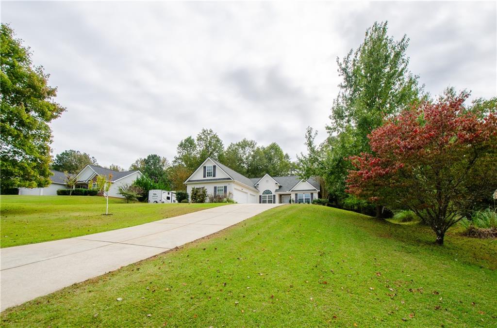 Beautiful Ranch Home On A Large 1.1 Acre Private Lot. Freshly Painted And Hardwood Flooring Throughout The Home Give The Home A Fresh, Airy Feel. The Family Room Features High Ceilings And A Fireplace. The Kitchen Has White Cabinetry And Granite Countertops. Dining Room Is Currently Used As A Sitting Room But It Can Fit A Full Sized Dining Room Set. Generously Sized Master On Main Suite Boasts A Large Walk-In Closet With Built-Ins. Two Additional Bedrooms And A Huge Bonus Room Offer Plenty Of Living Space. The Yard Is Very Large And Fenced. Three Car Garage! No HOA!