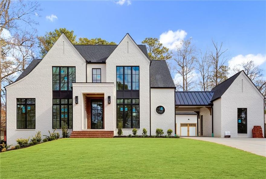 Nestled in the highly sought-after Indian Hills community, this exquisite 5-bedroom, 4.5-bath home with a 3-car garage and a Unfinished Terrace Level.  Situated on an incredible walk out lot, this custom-designed residence promises an exceptional living experience from the moment you step through the grand iron and glass front door as your greeted with 11ft ceilings on main level. The family room is a true masterpiece, combining both functionality and aesthetics, with its centerpiece being a stunning fireplace that adds a touch of sophistication to any gathering. The chef’s kitchen is a culinary dream, outfitted with high-end appliances, premium fixtures, and an open layout that flows seamlessly into the dining and living areas. Adjacent to the kitchen, you’ll find a well-appointed scullery, offering a tucked-away space for additional meal preparation and storage—perfect for entertaining. The main level features a spacious vaulted second owner’s suite, serving as a private sanctuary complete with a spa-inspired bathroom, dual vanities, a large walk-in shower, and a soaking tub. Upstairs, discover a second primary suite along with two additional bedrooms, each offering generous closet space and private ensuite baths. Step outside to the expansive, walk-out backyard—a true entertainer’s paradise. Enjoy cooler evenings on the large patio with an outdoor fireplace, and take advantage of the ample space for a future pool. Ideally located within the top-rated Walton school district, this home provides easy access to upscale dining, boutique shopping, and vibrant entertainment. Experience the perfect blend of luxury and comfort in this one-of-a-kind home.