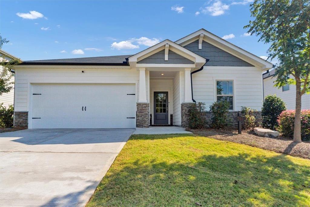Beautiful Craftsman Home in Prime Location! This stunning 3-year-old Craftsman-style home blends modern efficiency with timeless charm. Featuring 3 bedrooms, 2.5 bathrooms, and an open-concept design, this home is perfect for both entertaining and everyday living. The open, light and bright living space is oh so welcoming!
The chef’s kitchen boasts a walk-in pantry, an oversized quartz island, and stylish fixtures, flowing seamlessly into the main living space. The luxurious primary suite offers a spa-like walk-in shower and a custom-designed walk-in closet. The Jack-and-Jill bathroom serves the secondary bedrooms for family and/or guests. And, you’ll enjoy a bonus room to make into whatever your heart desires – office, living space, playroom, etc.
Step outside to enjoy your fenced backyard and private patio, or take advantage of the community amenities including sidewalks, a park, and a swimming pool.
Located in a highly sought-after neighborhood, you’ll be just minutes from I-575, shopping, dining, vibrant Downtown Woodstock and even Lake Allatoona. Don’t miss the opportunity to call this beautiful home yours—it’s truly move-in ready and waiting for you!