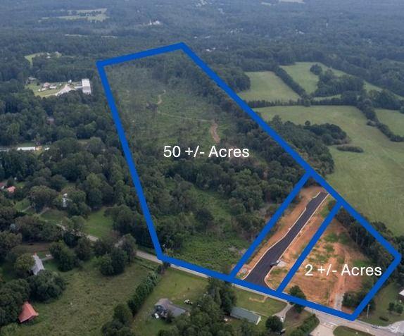 50 +/- Acres with Road Frontage of Unimproved Land. Only 11 miles from I-20 and 4 miles from Downtown Carrollton. Zoned Light Industrial in the City of Carrollton. Easy access to 61 with traffic light. All utilities are on the property with 12" water main and sewer. Additional 2 +/- Acres with Road Frontage available under separate listing.