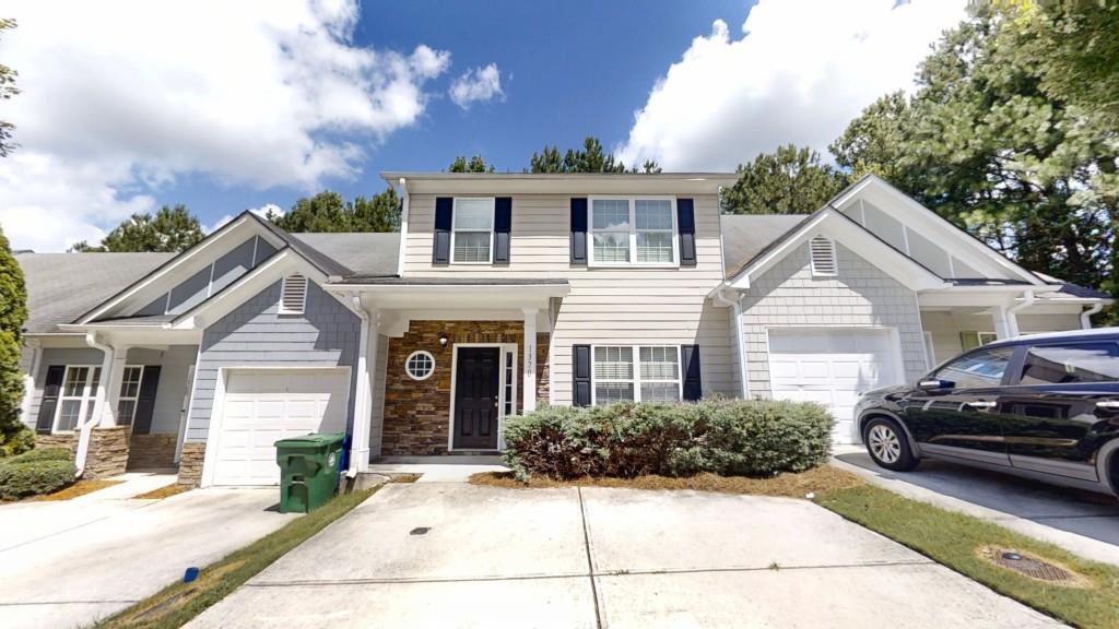Welcome to this well-maintained 3-bedroom, 2.5-bath townhouse in the sought-after Villas at Rogers Crossing! Freshly painted throughout, this home features durable LVP flooring on the main level and in wet areas, with cozy carpet upstairs for added comfort. Enjoy a spacious family room perfect for relaxing or entertaining, and a well-appointed kitchen with elegant stone countertops and plenty of storage space. Step outside to the rear deck a great spot for barbecues, entertaining, or simply enjoying your morning coffee. Conveniently located just minutes from I-20, shopping, restaurants, and schools, this home offers the perfect combination of comfort, style, and accessibility. Don't miss your chance to own this move-in-ready home in a great location!